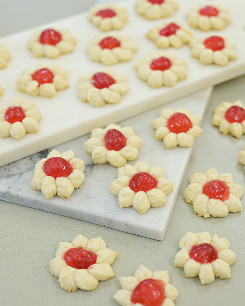 pressed butter cookies with poinsettia and cherry center from Minette Rushing